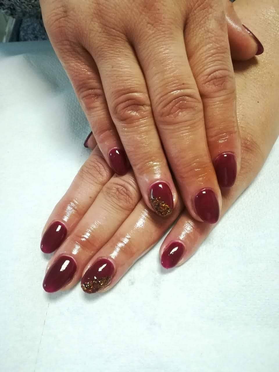Deep burgundy Shellac with gold glitter accents